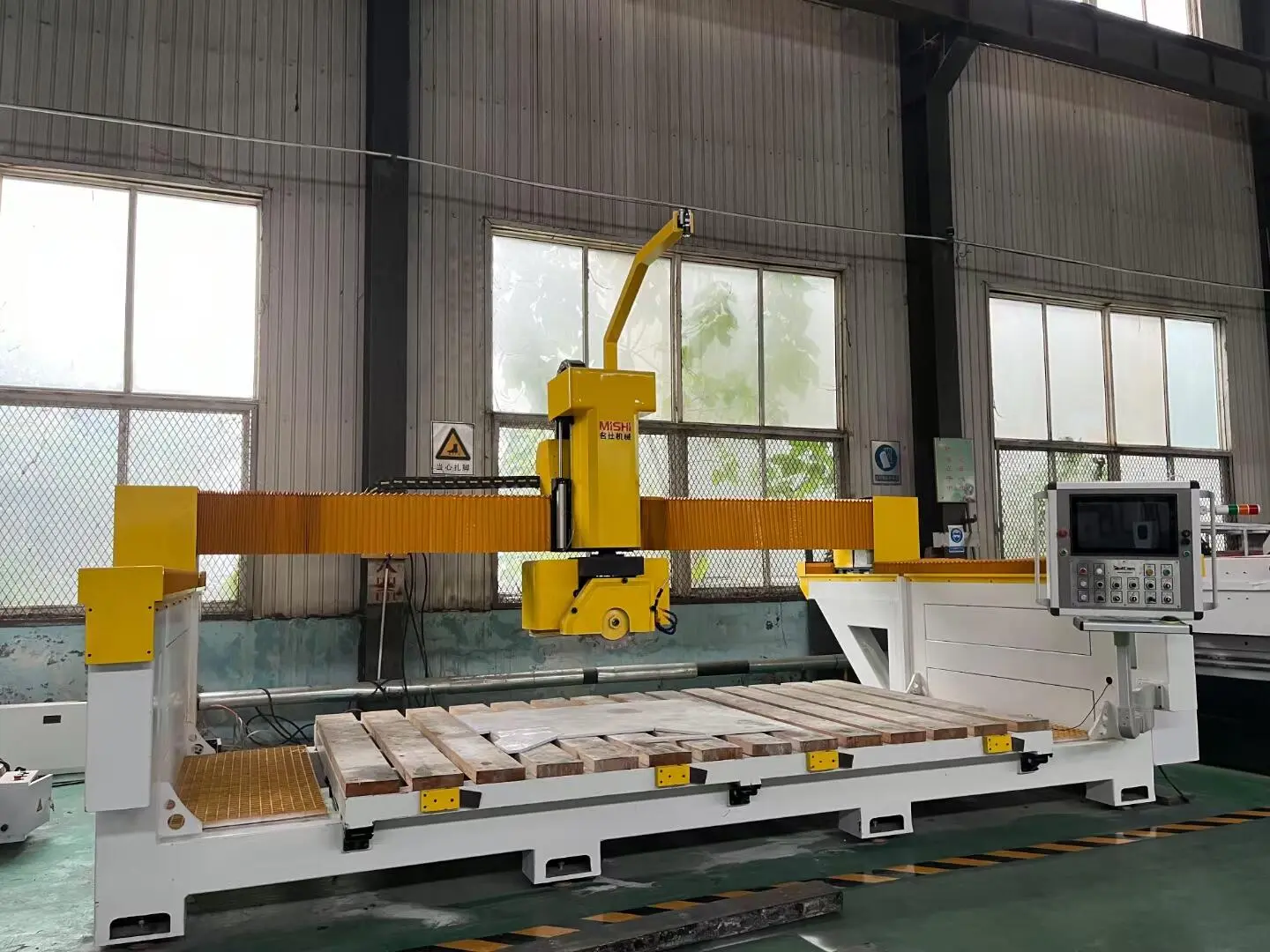 Five-axis machine for stone fabrication